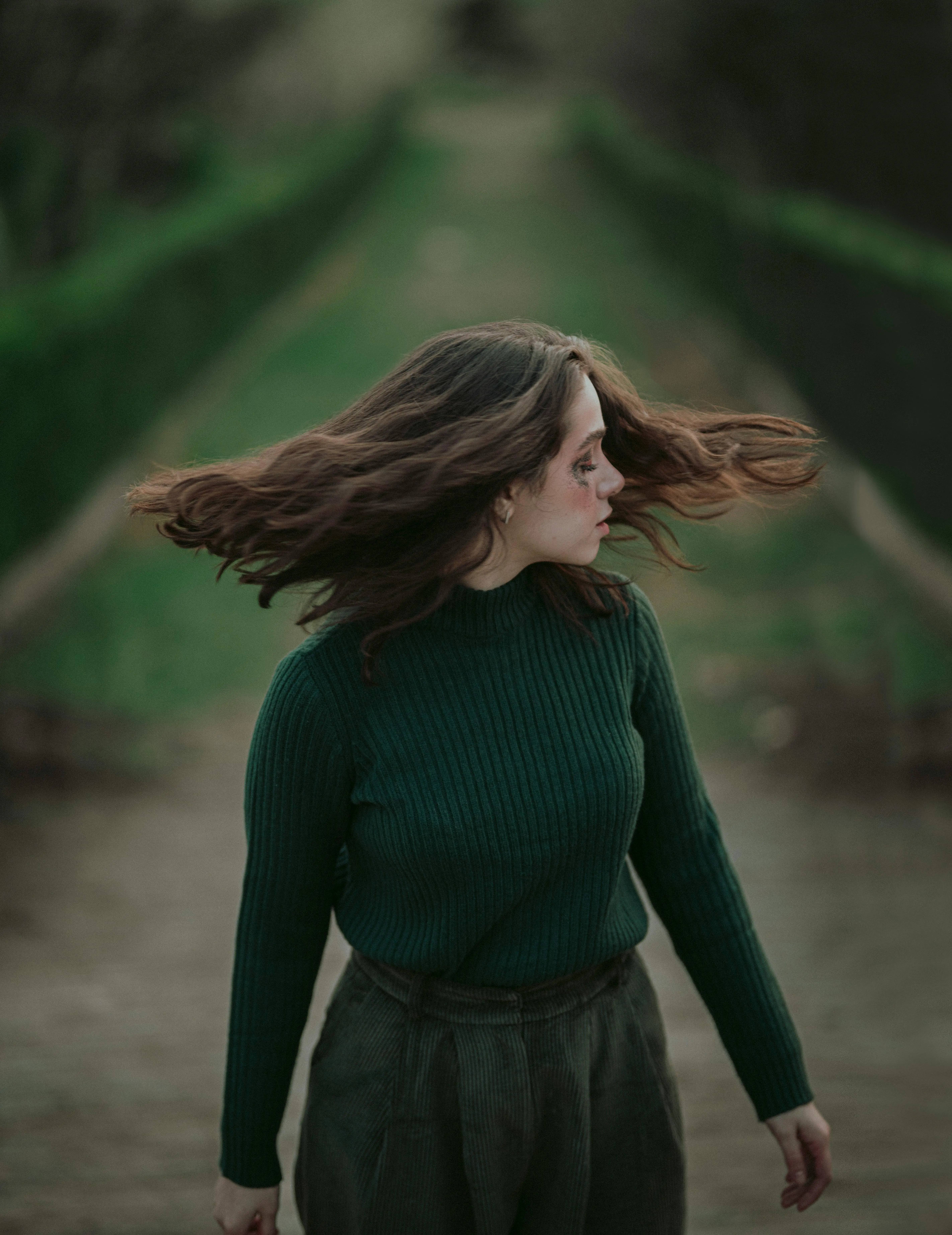 Stylised portrait illustration of a person in a green sweater